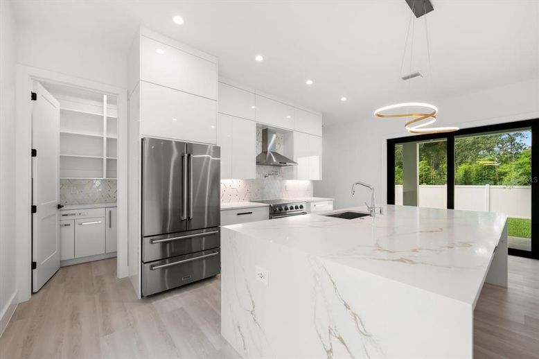Interior, Kitchen, Pendant Lights, Recessed Lighting, Stainless Steel Appliances, Wood Texture Flooring