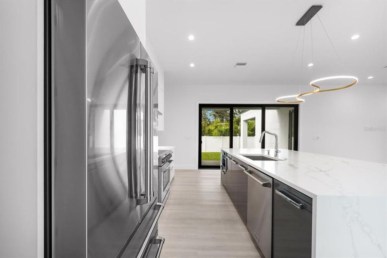 Interior, Kitchen, Pendant Lights, Recessed Lighting, Stainless Steel Appliances, Wood Texture Flooring