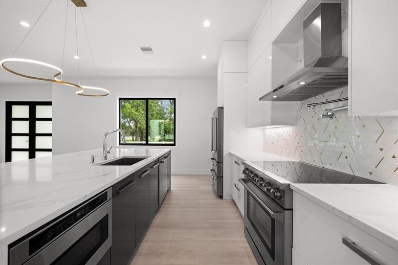 Interior, Kitchen, Pendant Lights, Recessed Lighting, Stainless Steel Appliances, Wood Texture Flooring