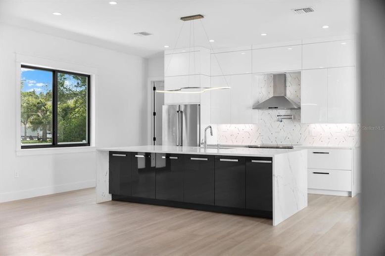 Interior, Kitchen, Marble Walls, Pendant Lights, Recessed Lighting, Stainless Steel Appliances, Wood Texture Flooring
