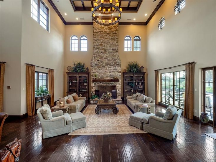 Chandelier, Fireplace, Interior, Living room, Recessed Lighting, Stone Walls, Wood Texture Flooring