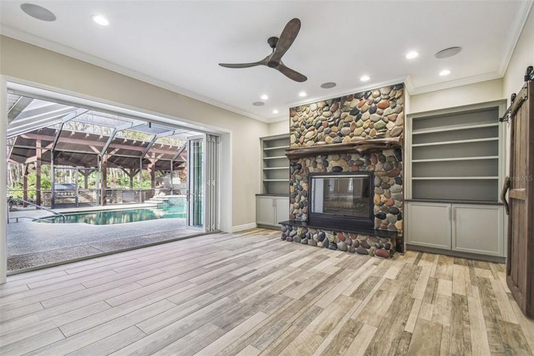 Fireplace, Interior, Recessed Lighting, Stone Walls, Wood Texture Flooring