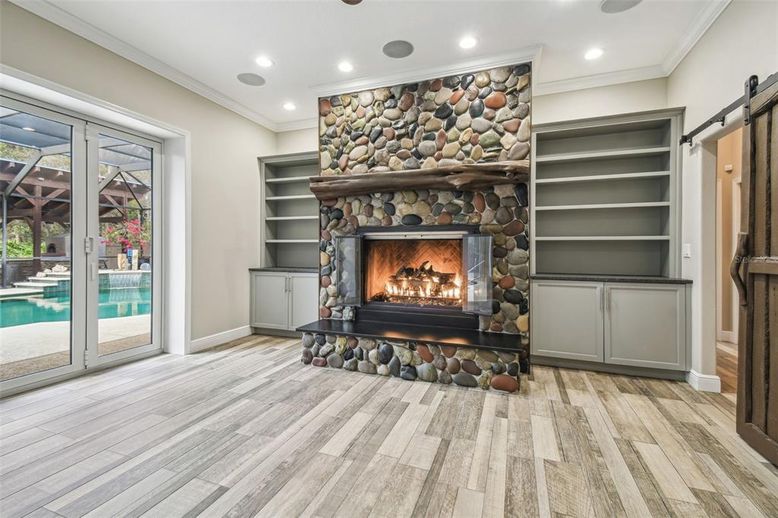 Fireplace, Interior, Recessed Lighting, Stone Walls, Wood Texture Flooring
