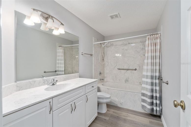 Bathroom, Glass Shower, Interior, Marble Walls, Wood Texture Flooring
