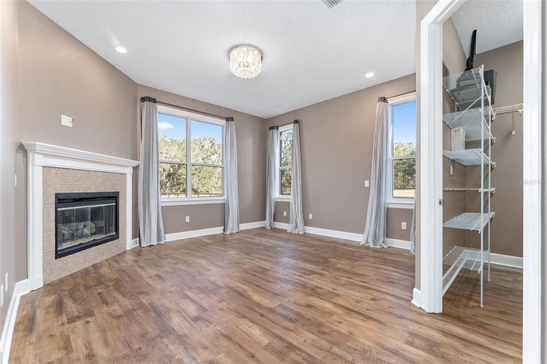 Empty room, Fireplace, Interior, Recessed Lighting, Wood Texture Flooring
