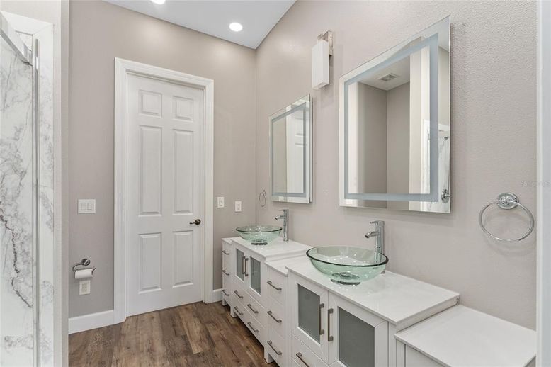 Bathroom, Dual Sink Vanities, Interior, Recessed Lighting, Wood Texture Flooring