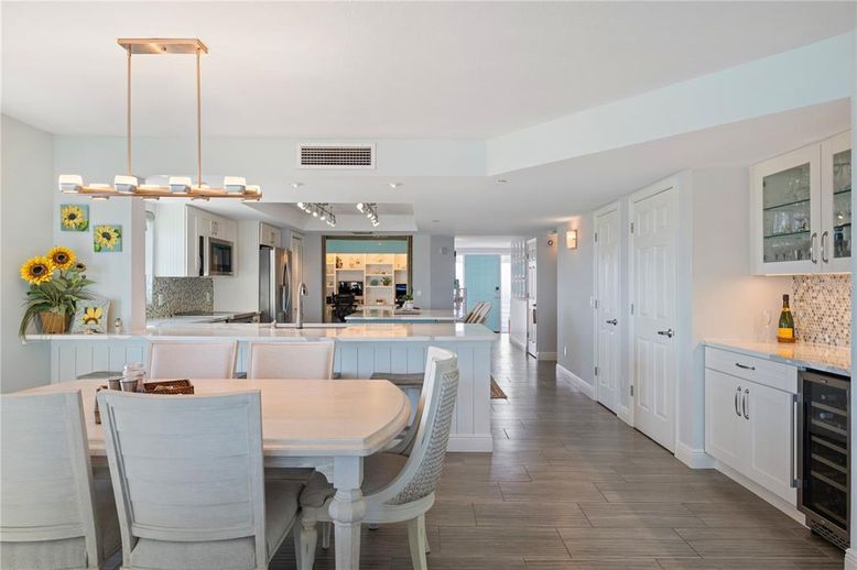 Dining room, Interior, Kitchen, Pendant Lights, Recessed Lighting, Stainless Steel Appliances, Wood Texture Flooring