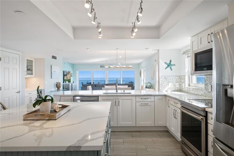Dining room, Interior, Kitchen, Pendant Lights, Stainless Steel Appliances, Water, Wood Texture Flooring