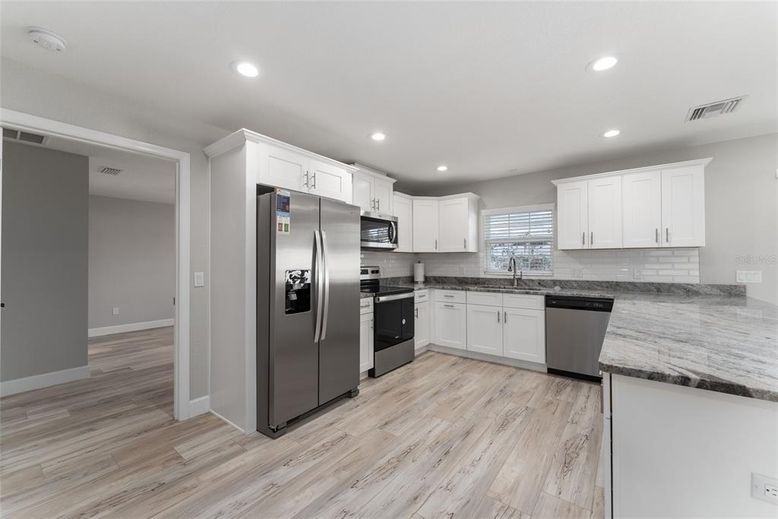 Interior, Kitchen, Recessed Lighting, Stainless Steel Appliances, Wood Texture Flooring