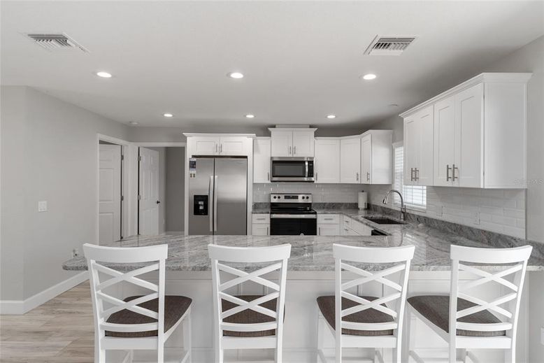 Interior, Kitchen, Recessed Lighting, Stainless Steel Appliances, Wood Texture Flooring