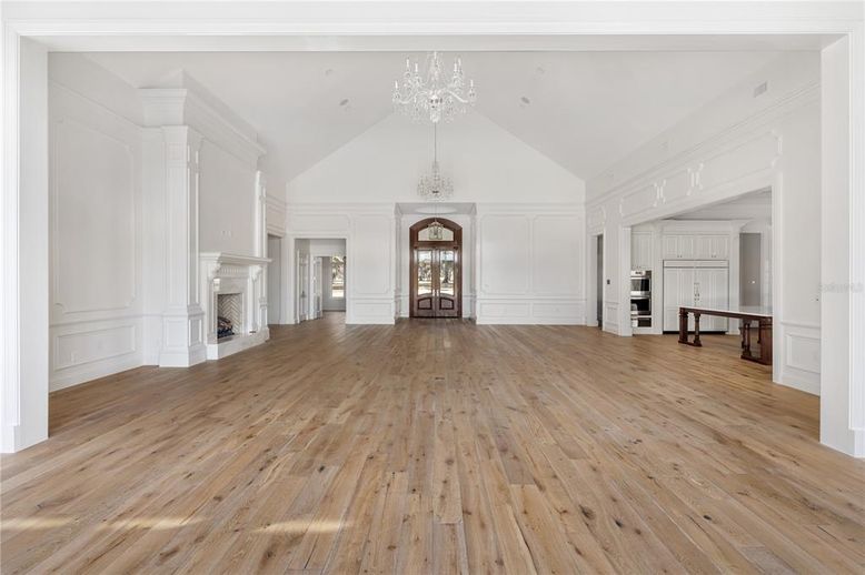 Chandelier, Empty room, Fireplace, Interior, Kitchen, Wood Texture Flooring