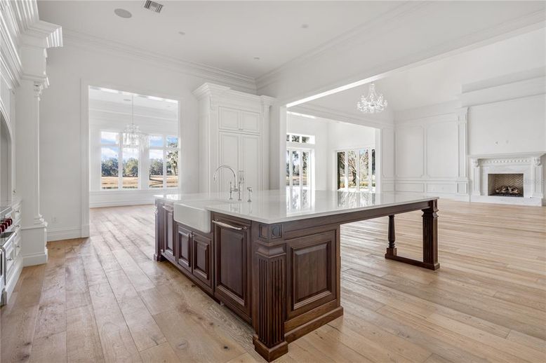 Chandelier, Fireplace, Interior, Kitchen, Pendant Lights, Recessed Lighting, Wood Texture Flooring