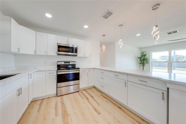 Interior, Kitchen, Pendant Lights, Recessed Lighting, Stainless Steel Appliances, Wood Texture Flooring