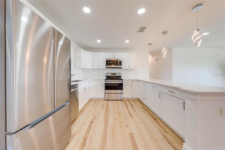 Interior, Kitchen, Pendant Lights, Recessed Lighting, Stainless Steel Appliances, Wood Texture Flooring