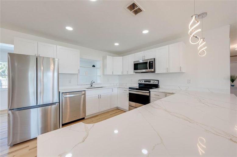 Interior, Kitchen, Pendant Lights, Recessed Lighting, Stainless Steel Appliances, Wood Texture Flooring