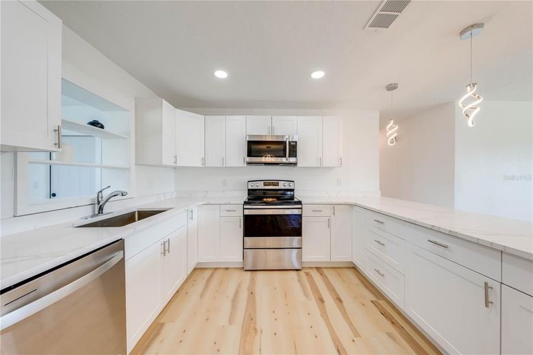 Interior, Kitchen, Pendant Lights, Recessed Lighting, Stainless Steel Appliances, Wood Texture Flooring