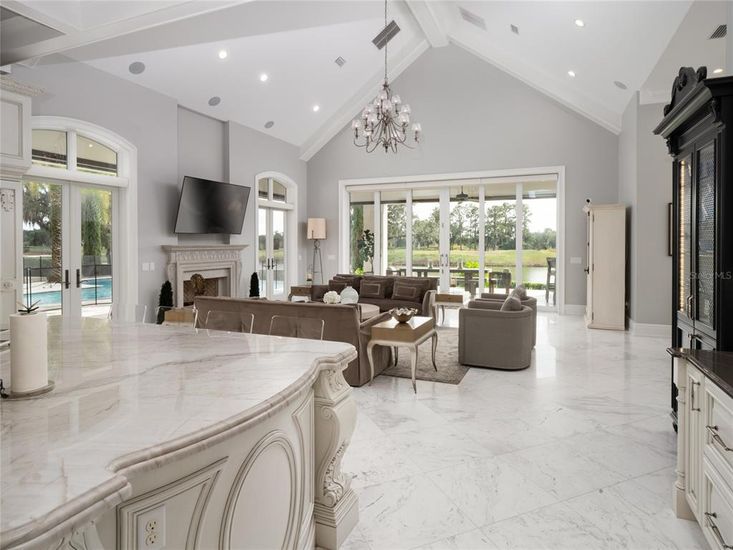 Chandelier, Fireplace, Interior, Living room, Marble, Recessed Lighting