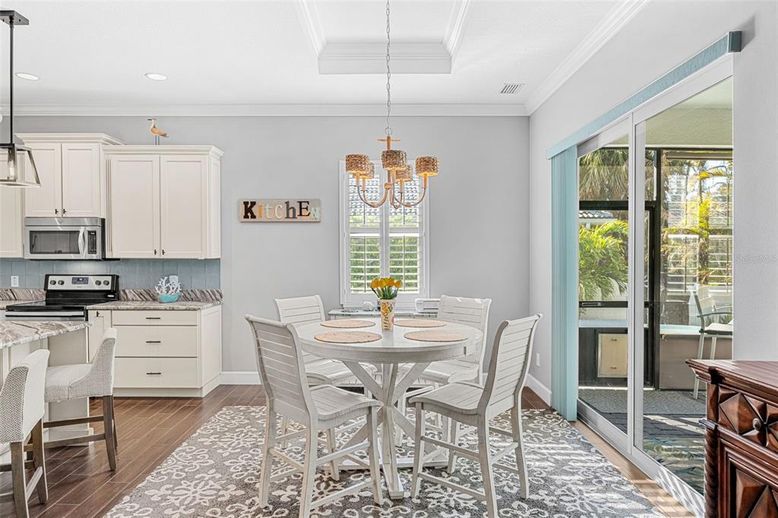 Dining room, Interior, Kitchen, Pendant Lights, Recessed Lighting, Stainless Steel Appliances, Wood Texture Flooring