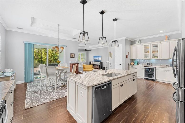 Dining room, Interior, Kitchen, Pendant Lights, Recessed Lighting, Stainless Steel Appliances, Wood Texture Flooring