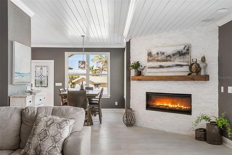 Dining room, Fireplace, Interior, Living room, Pendant Lights, Stone Walls, Wood Texture Flooring