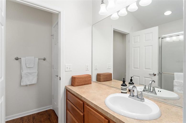 Bathroom, Dual Sink Vanities, Interior, Recessed Lighting, Wood Texture Flooring
