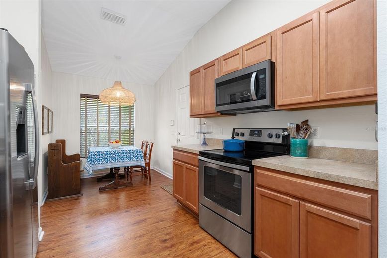 Dining room, Interior, Kitchen, Pendant Lights, Stainless Steel Appliances, Wood Texture Flooring