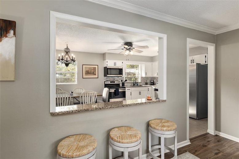 Chandelier, Dining room, Interior, Kitchen, Stainless Steel Appliances, Wood Texture Flooring
