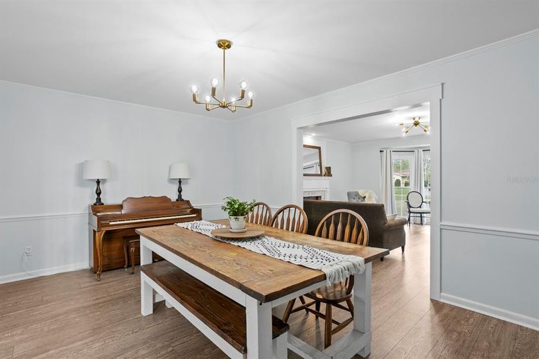 Chandelier, Dining room, Interior, Piano, Wood Texture Flooring