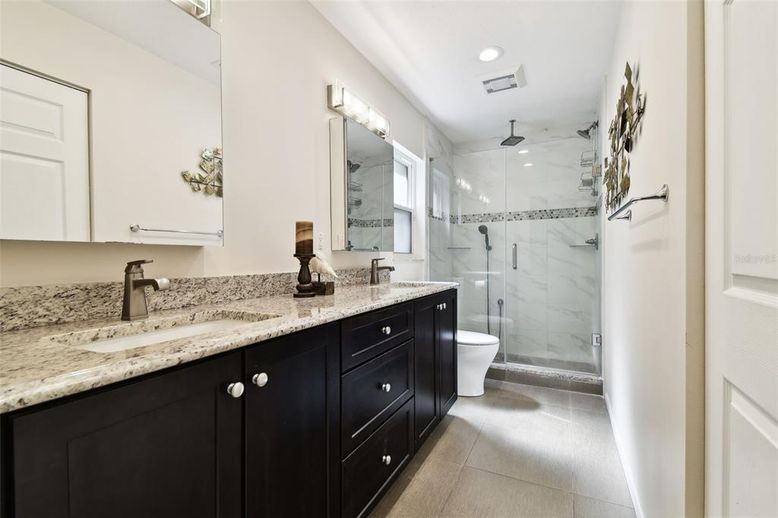 Bathroom, Dual Sink Vanities, Free Standing Baths, Glass Shower, Interior, Marble Walls, Recessed Lighting