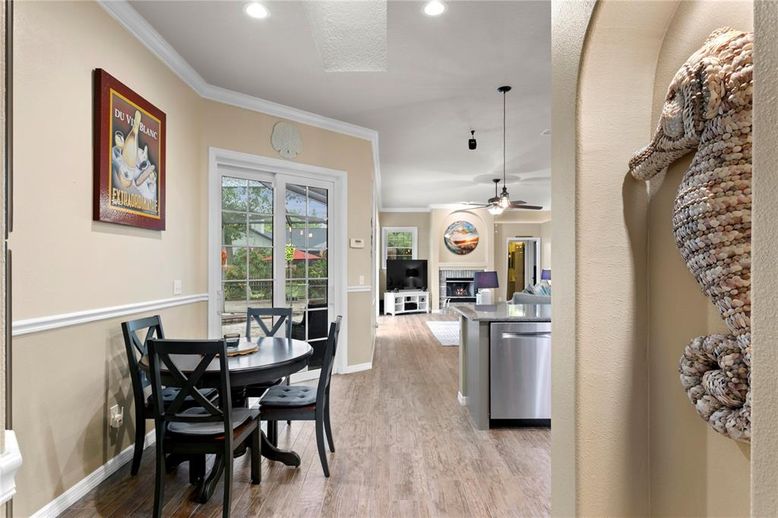 Dining room, Fireplace, Interior, Living room, Recessed Lighting, Wood Texture Flooring