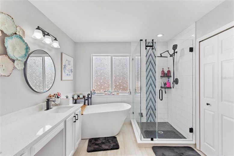 Bathroom, Dual Sink Vanities, Free Standing Baths, Glass Shower, Interior, Recessed Lighting, Wood Texture Flooring