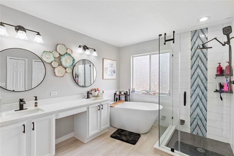 Bathroom, Dual Sink Vanities, Free Standing Baths, Glass Shower, Interior, Recessed Lighting, Wood Texture Flooring