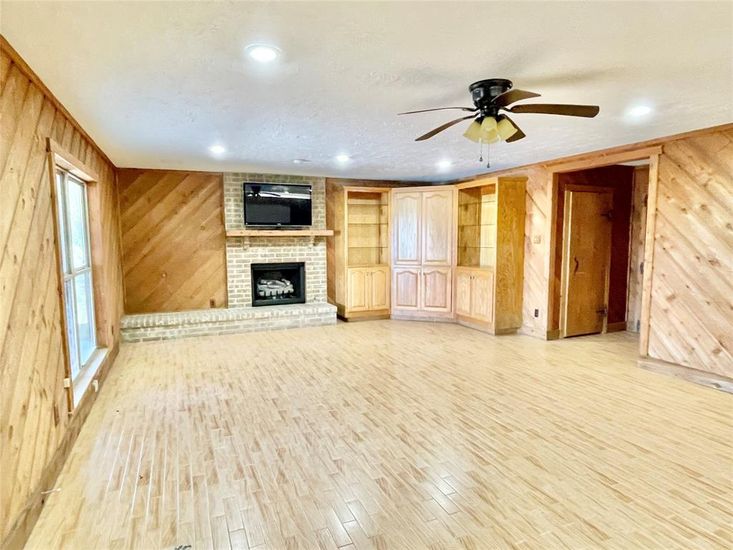 Empty room, Fireplace, Interior, Recessed Lighting, Wood Texture Flooring, Wooden Walls