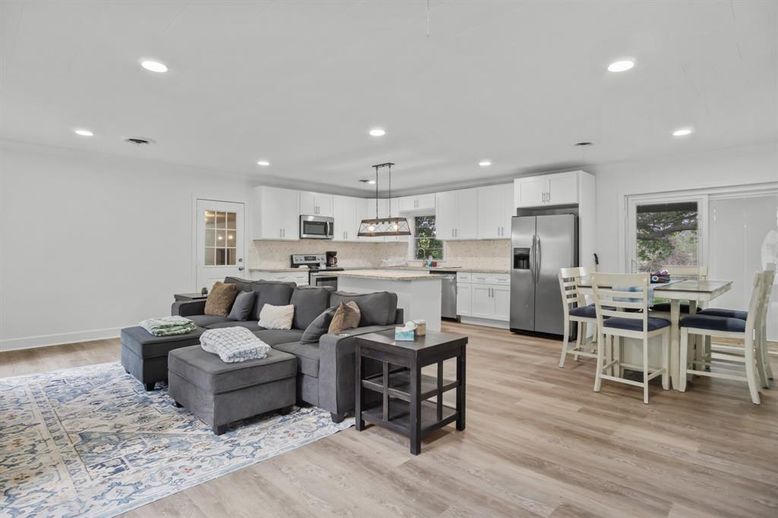 Dining room, Interior, Kitchen, Living room, Pendant Lights, Recessed Lighting, Stainless Steel Appliances, Wood Texture Flooring