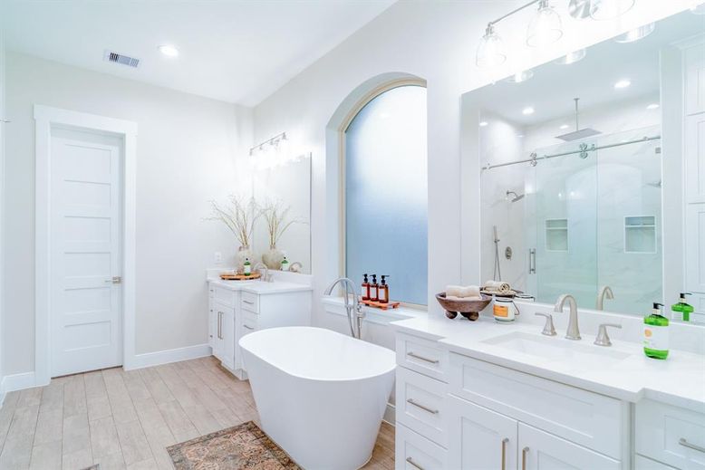 Bathroom, Dual Sink Vanities, Free Standing Baths, Glass Shower, Interior, Recessed Lighting, Wood Texture Flooring