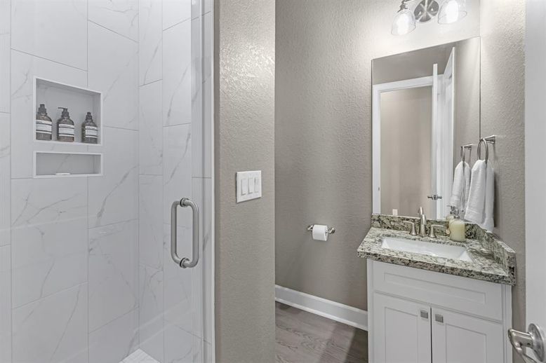 Bathroom, Glass Shower, Interior, Marble Walls, Wood Texture Flooring