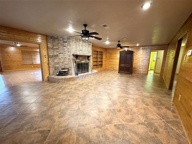 Empty room, Fireplace, Interior, Recessed Lighting, Stone Walls, Wooden Walls