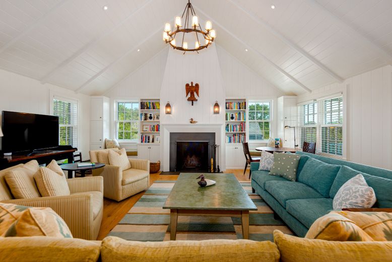 Chandelier, Dining room, Fireplace, Interior, Living room, Pendant Lights, Recessed Lighting, Wood Texture Flooring