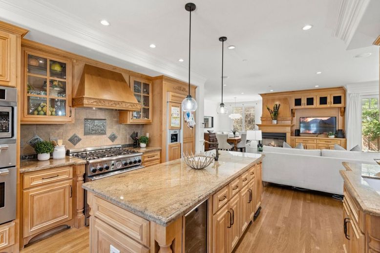 Dining room, Fireplace, Interior, Kitchen, Living room, Pendant Lights, Recessed Lighting, Stainless Steel Appliances, Wood Texture Flooring
