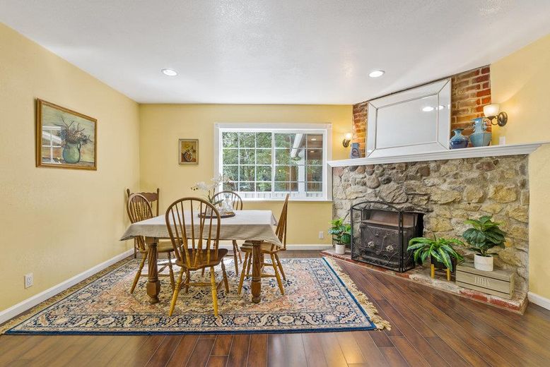 Dining room, Fireplace, Interior, Recessed Lighting, Stone Walls, Wood Texture Flooring