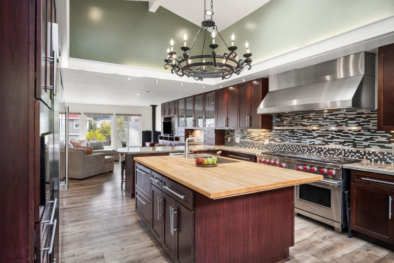 Chandelier, Interior, Kitchen, Living room, Recessed Lighting, Stainless Steel Appliances, Wood Texture Flooring
