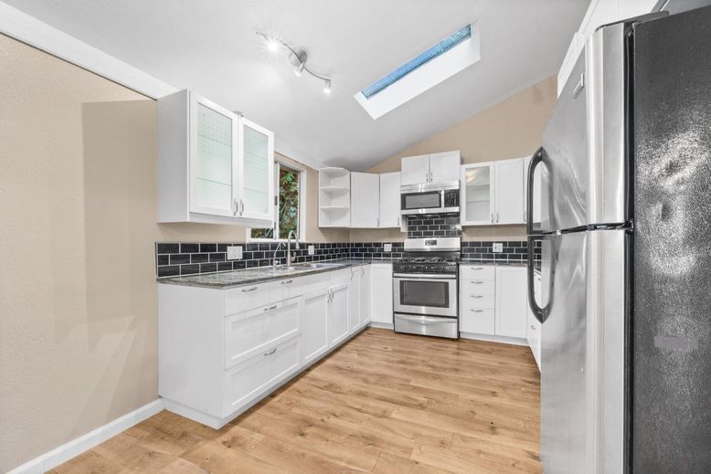 Interior, Kitchen, Stainless Steel Appliances, Tile Countertops, Wood Texture Flooring