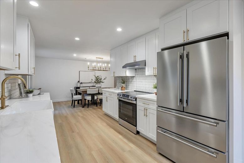 Chandelier, Dining room, Interior, Kitchen, Pendant Lights, Recessed Lighting, Stainless Steel Appliances, Wood Texture Flooring