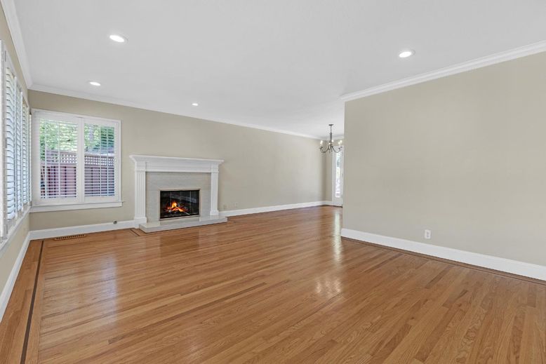 Chandelier, Empty room, Fireplace, Interior, Recessed Lighting, Wood Texture Flooring
