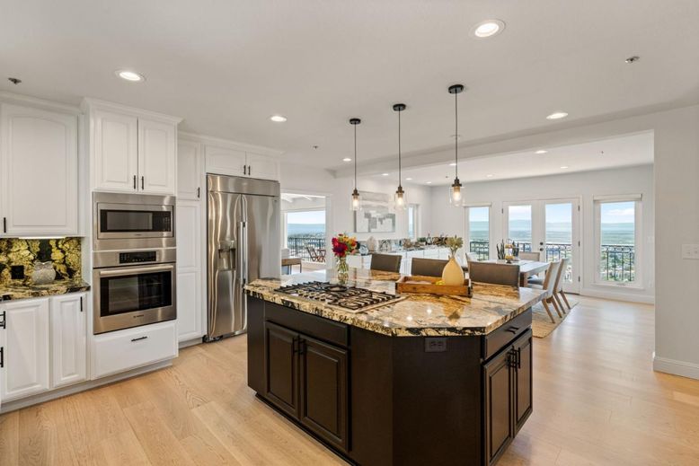 Dining room, Interior, Kitchen, Pendant Lights, Recessed Lighting, Stainless Steel Appliances, Water, Wood Texture Flooring