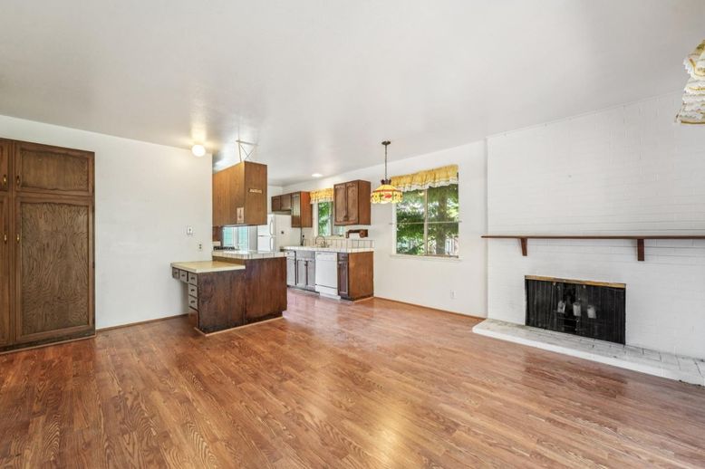 Empty room, Fireplace, Interior, Kitchen, Pendant Lights, Recessed Lighting, Wood Texture Flooring