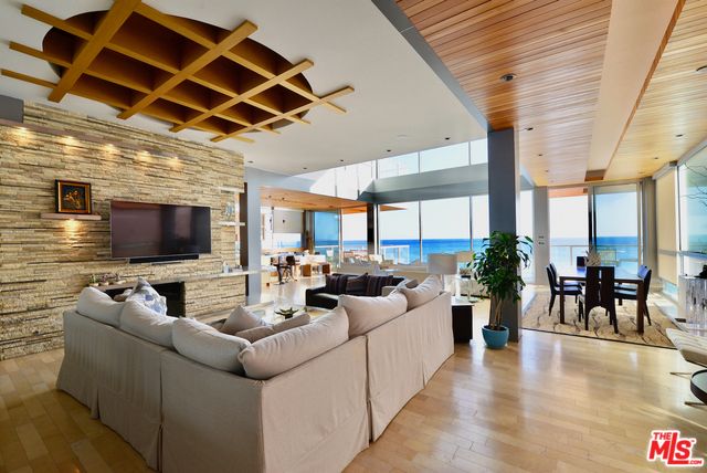 Dining room, Interior, Living room, Pendant Lights, Recessed Lighting, Stone Walls, Water, Wooden Beams, Wooden Ceilings, Wood Texture Flooring