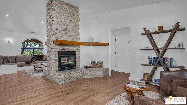 Fireplace, Interior, Living room, Recessed Lighting, Stone Walls, Wood Texture Flooring