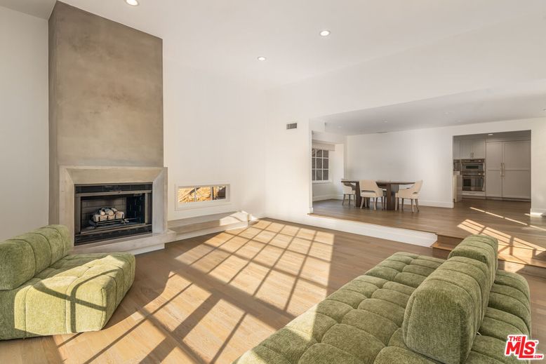 Dining room, Fireplace, Interior, Living room, Recessed Lighting, Wood Texture Flooring