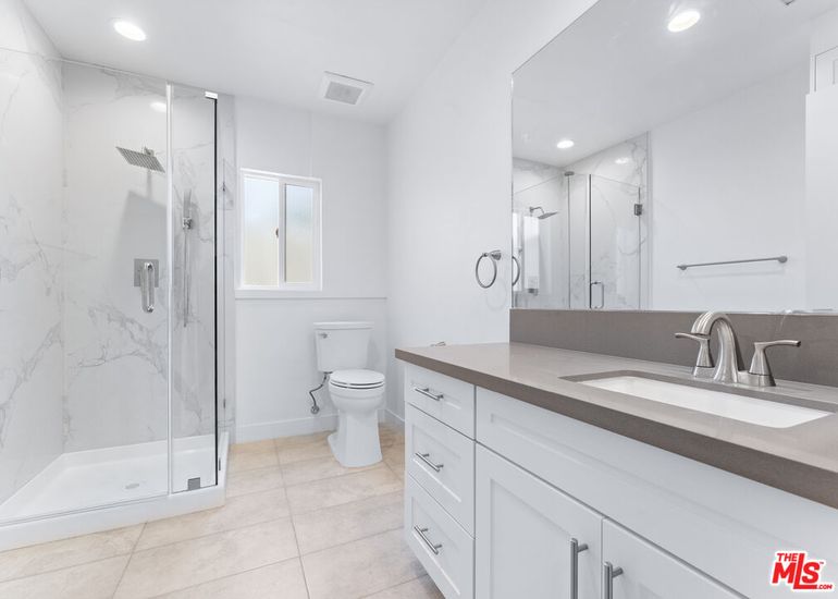 Bathroom, Dual Sink Vanities, Glass Shower, Interior, Marble Walls, Recessed Lighting